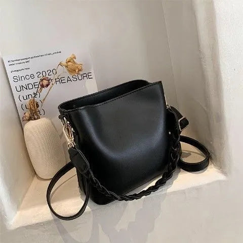 Retro woven PU bucket bag in khaki colour shown as crossbody and underarm bag