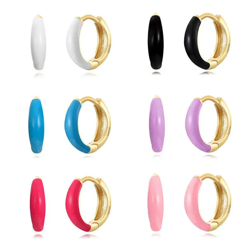 Geometric U-shaped epoxy earrings with a dripping oil finish in various colours.