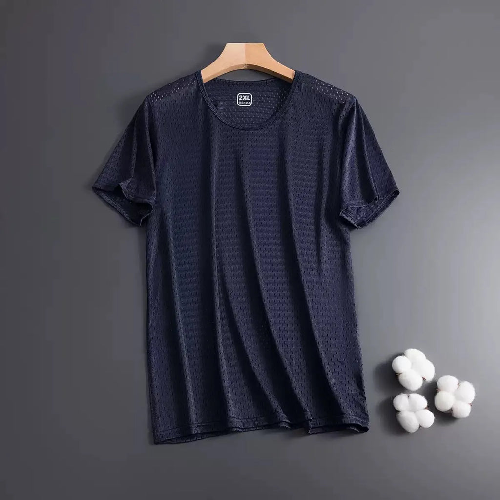 Man wearing a solid colour ice silk short sleeve crew neck T-shirt in a loose fit.