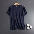 Man wearing a solid colour ice silk short sleeve crew neck T-shirt in a loose fit.