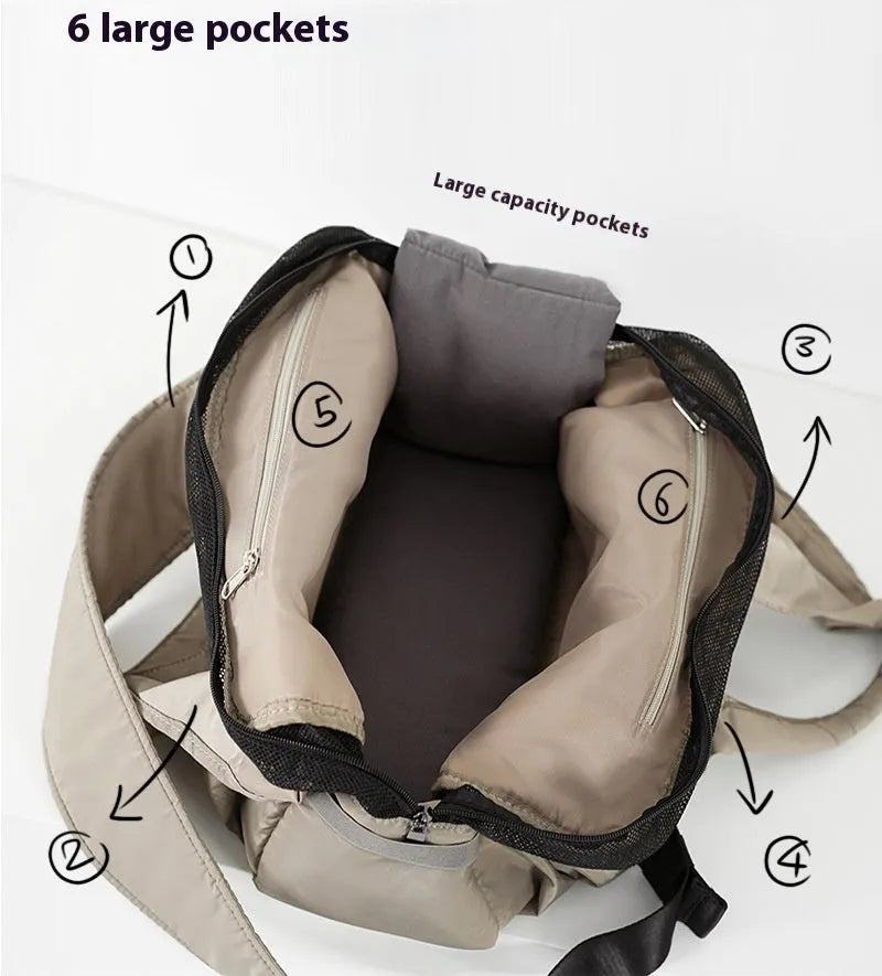 Apricot coloured cloth pet carrier handbag for small dogs or cats, showing carrying handles.