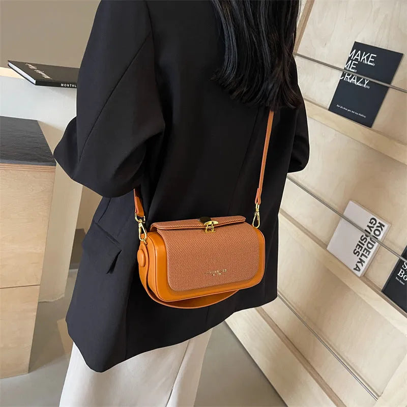 Women's black PU messenger bag with horizontal square shape and crossbody strap