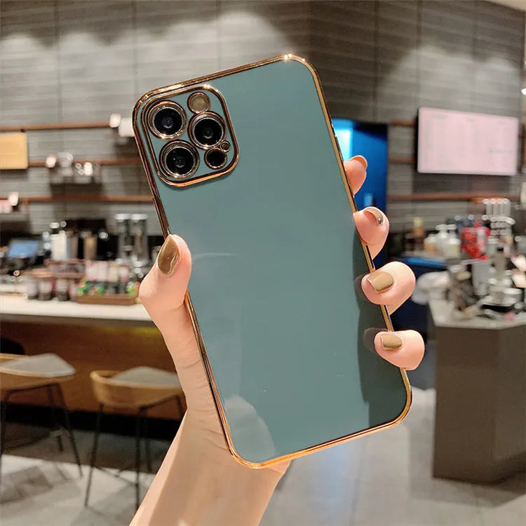 Gold plated electroplated iPhone case with silicone stripes on a tpu body in emerald green colour.