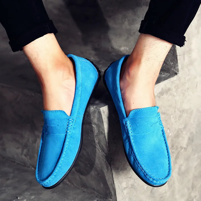 Men's suede Gommino-style loafers in a range of colours on a flat rubber sole.