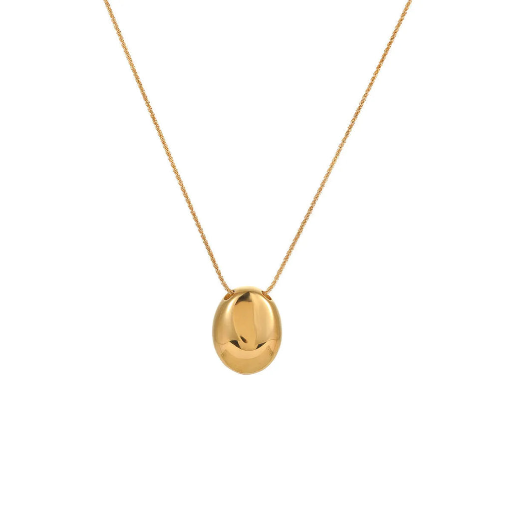 Gold-plated geometric pendant necklace with stainless steel chain on black background