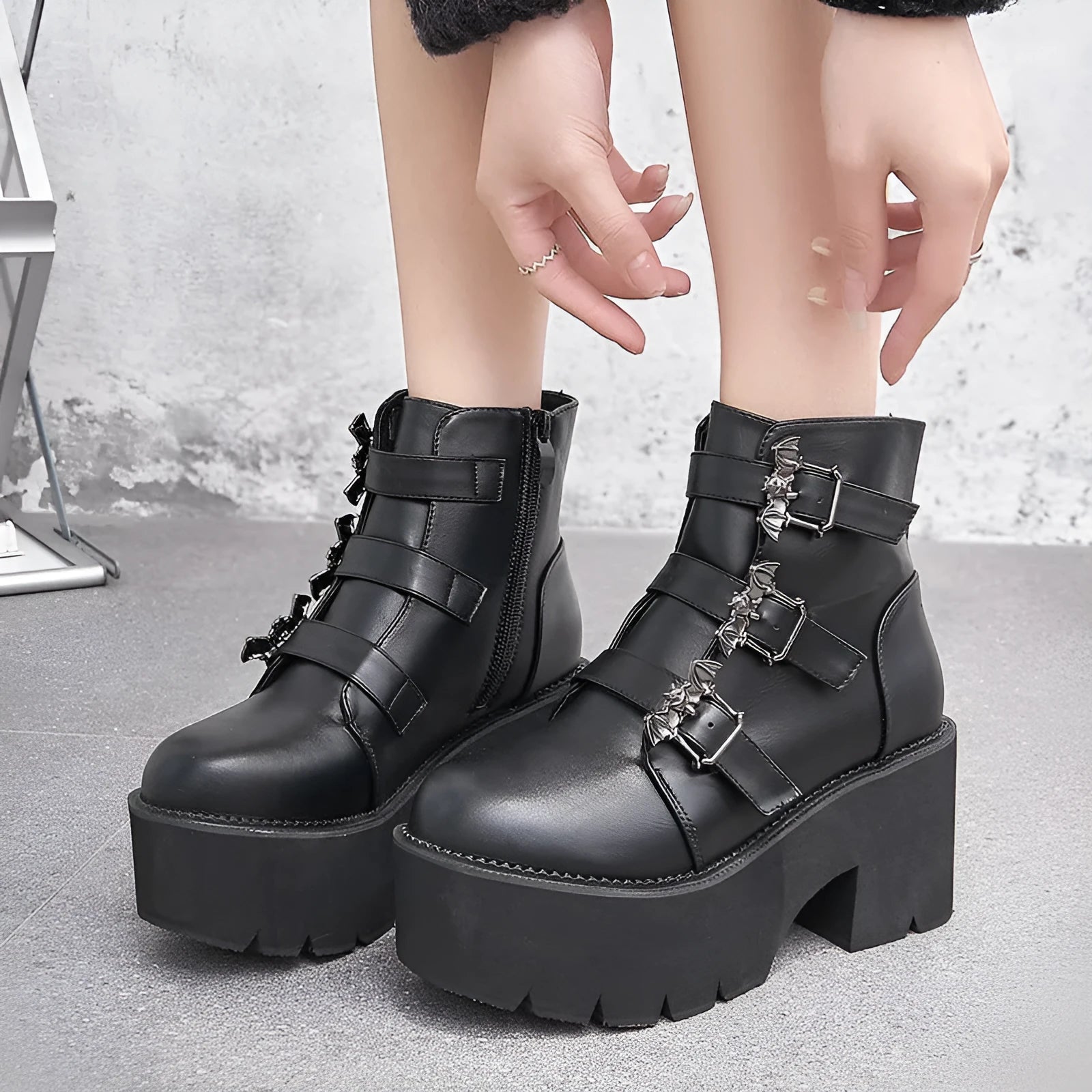 Black women's Harajuku punk gothic short boots with bat buckle and side zip.