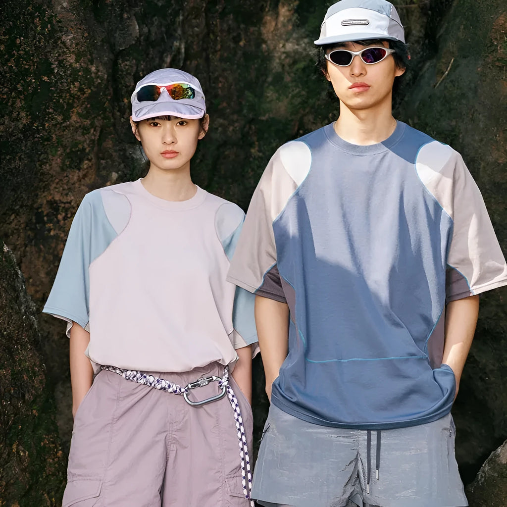 Men's loose fit blue patchwork sports T-shirt with raglan short sleeves on a hanger.