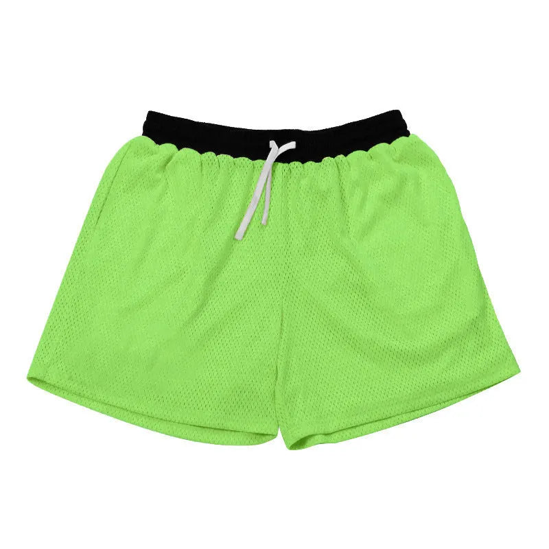 Men's solid colour mesh quick-drying sports shorts for running and fitness.