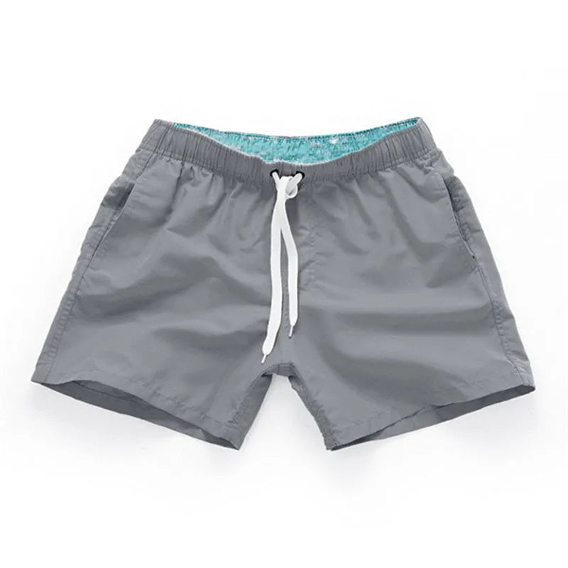 Men's polyester beach shorts in multiple colours with straight leg design for surfing and casual wear