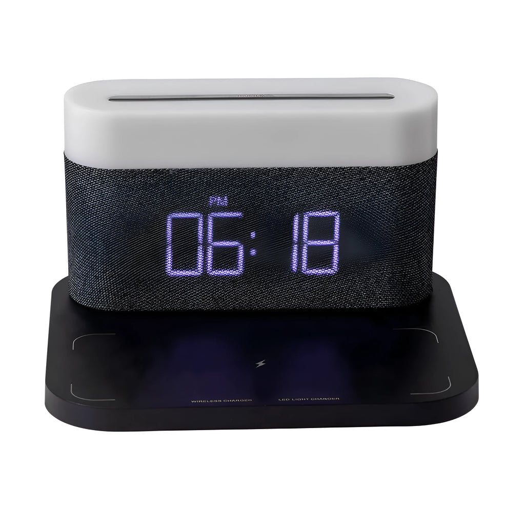 Black wireless charging desk clock with LED display and night light on wooden surface