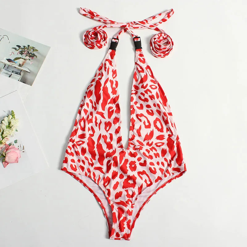Women's leopard print one-piece bandage swimsuit with buckle detail, shown in a backless design.