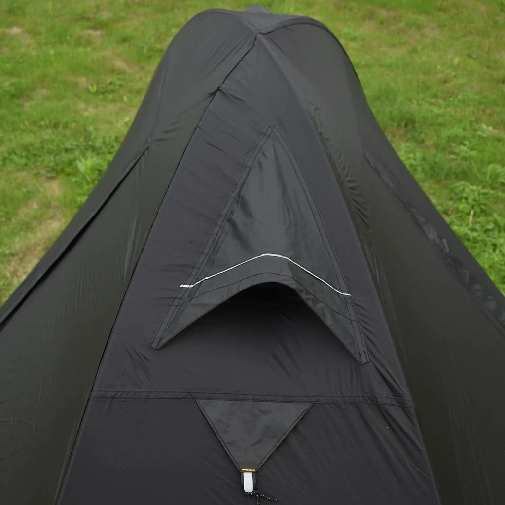 Single person backpacking tent with aluminium poles shown in a red colour option, pitched outdoors.