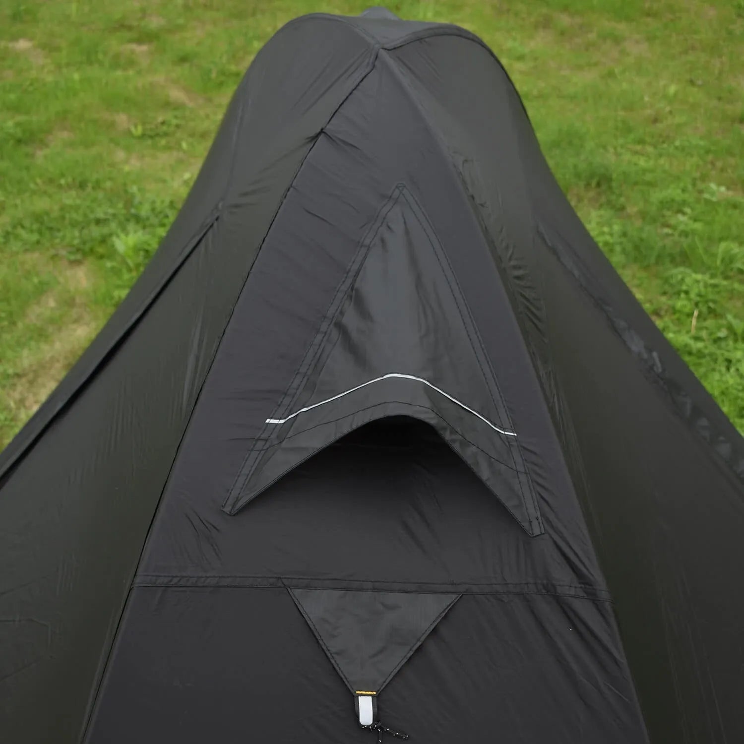 Single person backpacking tent with aluminium poles shown in a red colour option, pitched outdoors.