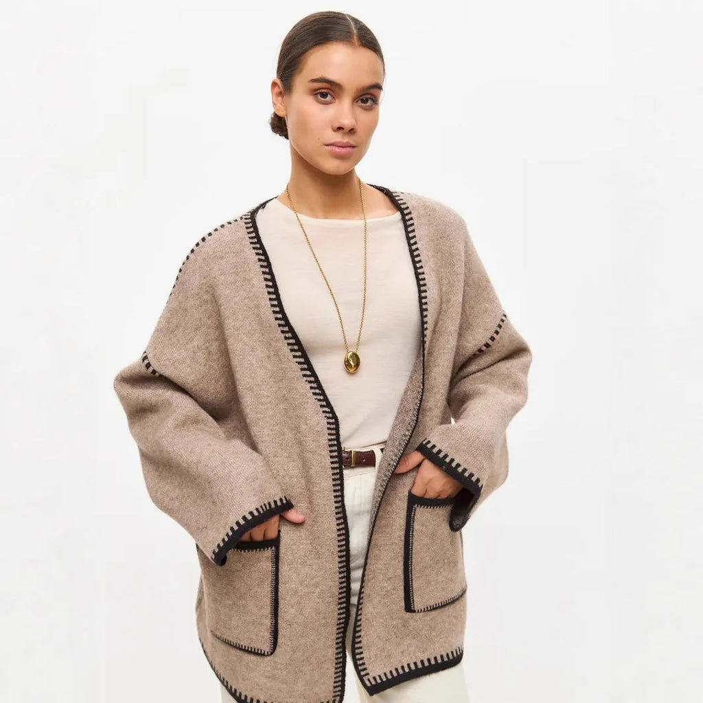 Lace-up front knitted cardigan in imitation cashmere fabric showing loose fitting design and long sleeves
