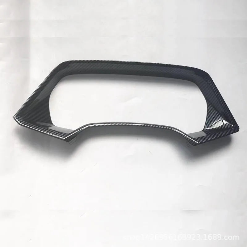 Dashboard decorative frame for BMW X5L in carbon fibre and peach wood finish options.