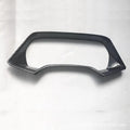 Dashboard decorative frame for BMW X5L in carbon fibre and peach wood finish options.