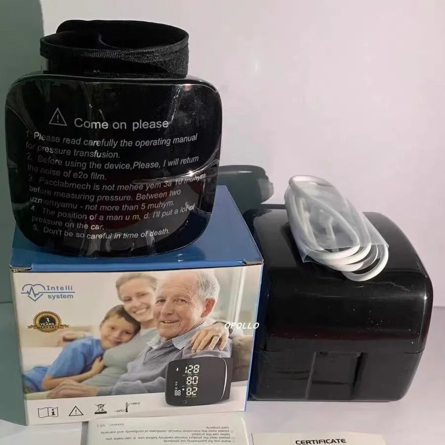 Black wrist blood pressure monitor with digital display and USB charging port.