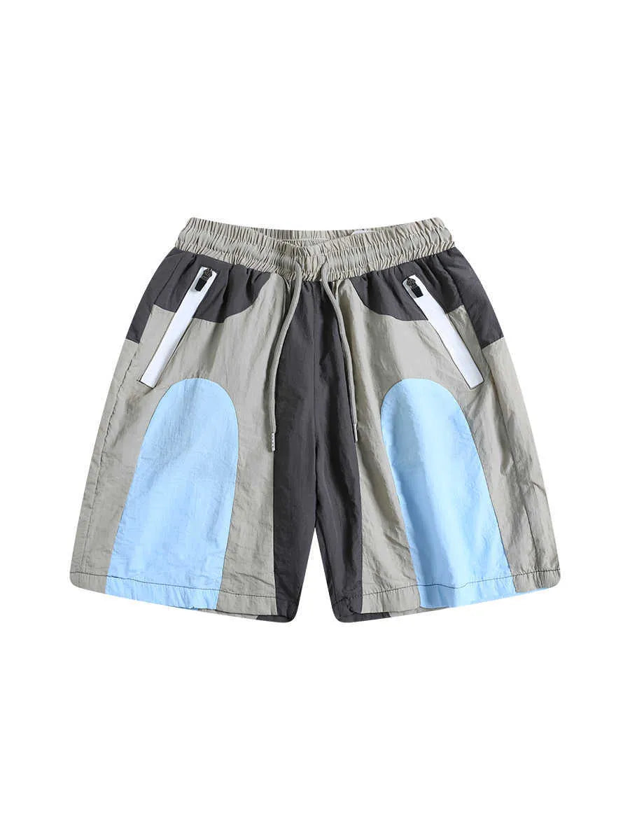 Blue men's loose patchwork quick-drying sports shorts with straight legs and elasticated waist.