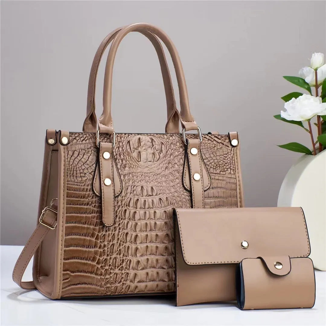 Minimalist textured PU three-piece bag set showing crossbody bag, wallet, and card holder in a contrast colour.