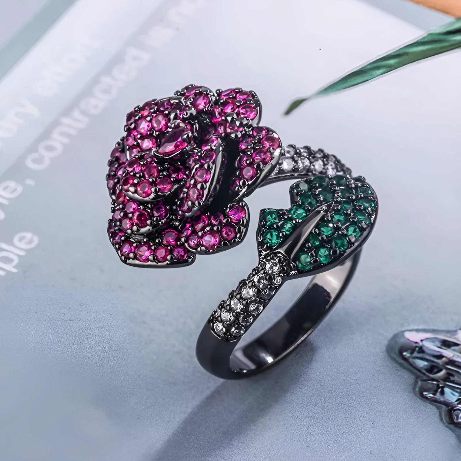 Black gold colour women's ring with geometric flower design and simulation red corundum stone