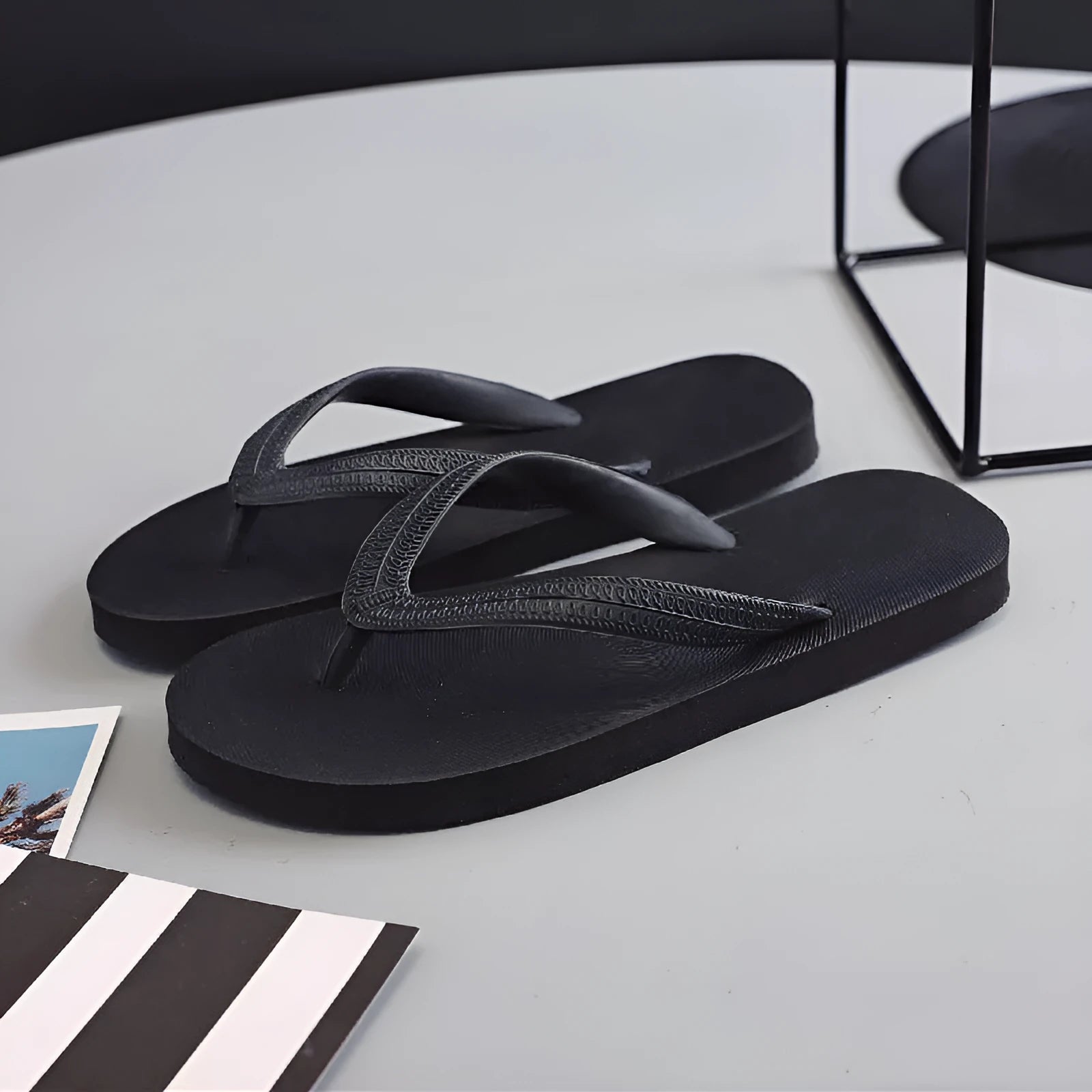 Fish label rubber beach flip-flops in green, red, blue, or black, showing non-slip sole.
