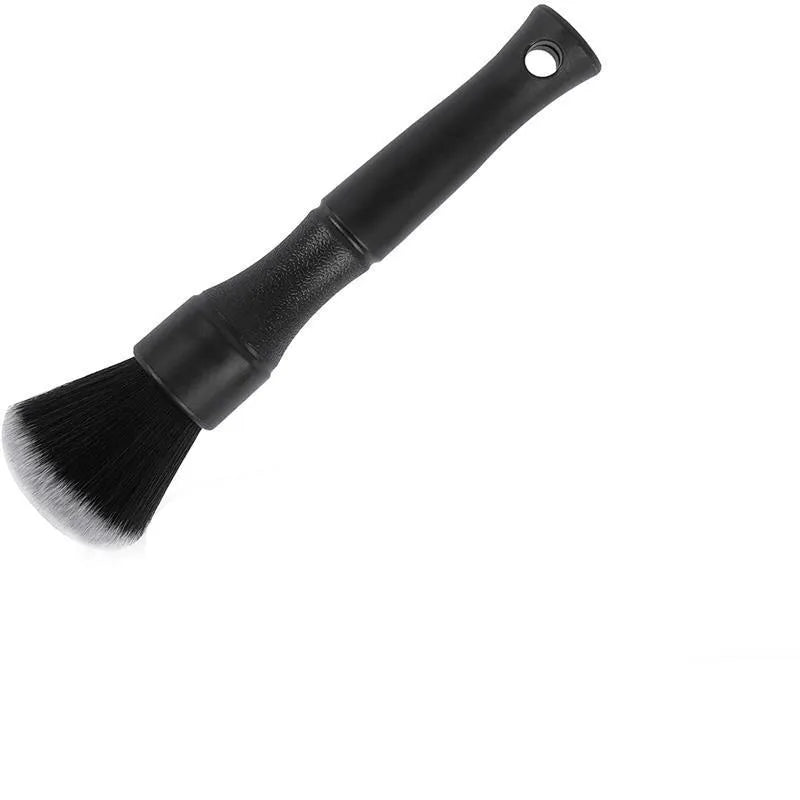 Black car detailing brush with ultra-soft pig hair bristles and a plastic handle.