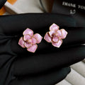 Gold plated purple flower stud earrings with an oil-spot glaze effect on copper