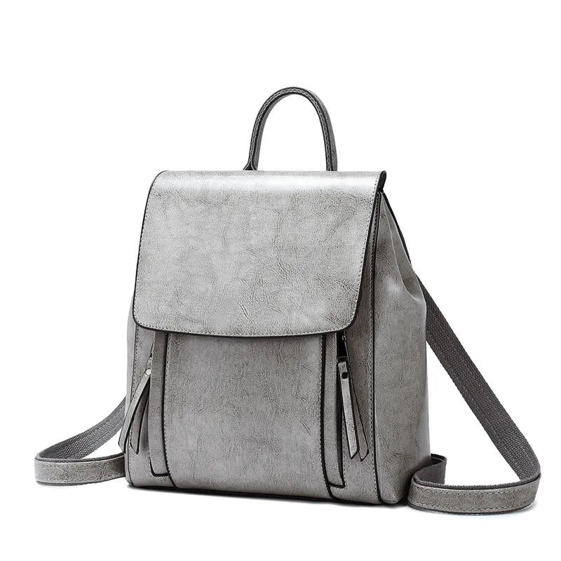 Large genuine leather women's backpack in black with stitching detail and dual straps.