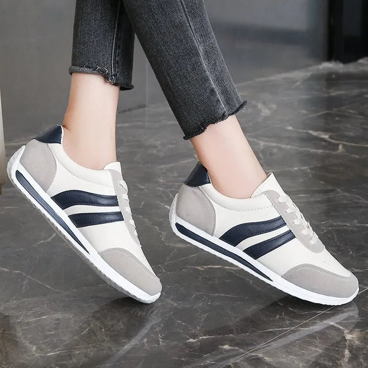 Red and blue low-top lace-up running sneakers on a white background.
