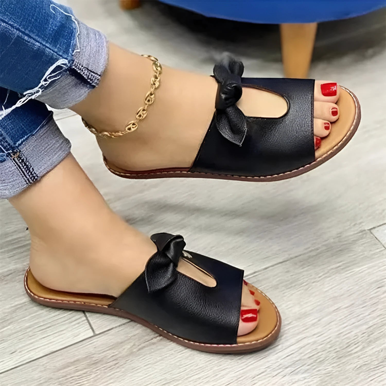 Ladies black fish mouth sandals with a decorative bow on the artificial PU upper.