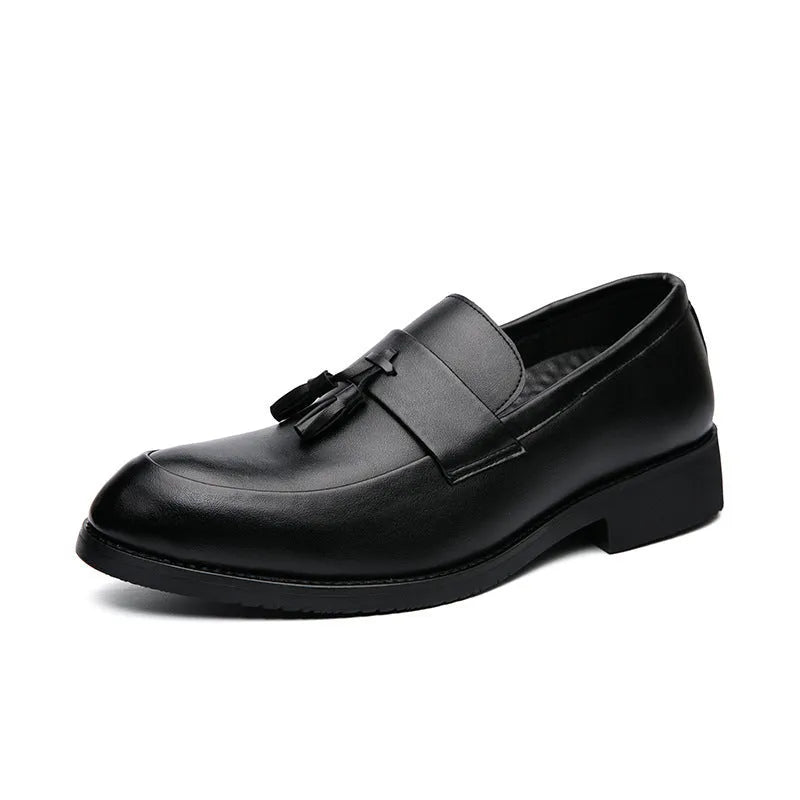Men's black slip-on business casual shoe with a tassel detail on a low-top artificial PU upper.