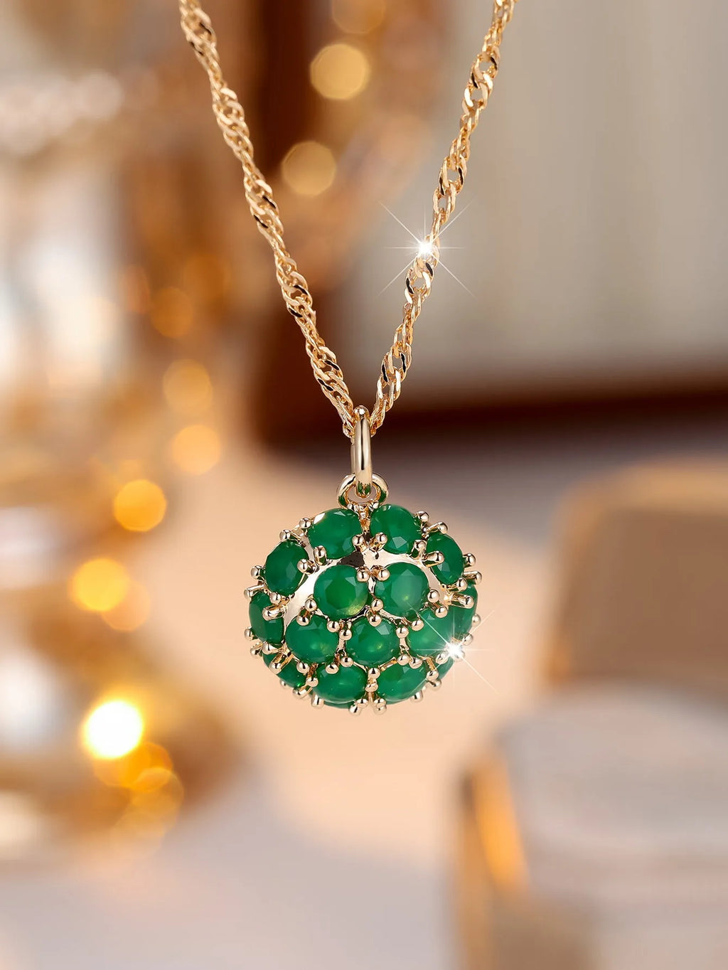 Round emerald diamond necklace with champagne gold electroplated finish on geometric pendant and chain