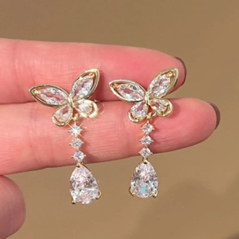 Platinum bow-shaped stud earrings with electroplated finish