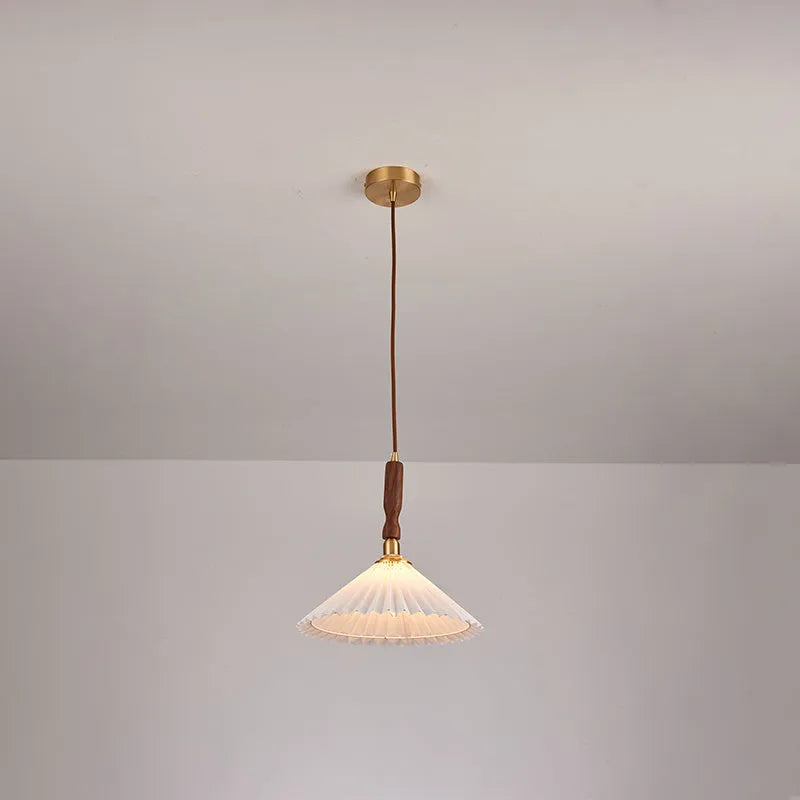 American retro style wall lamp with fabric shade and wooden frame in bedside setting