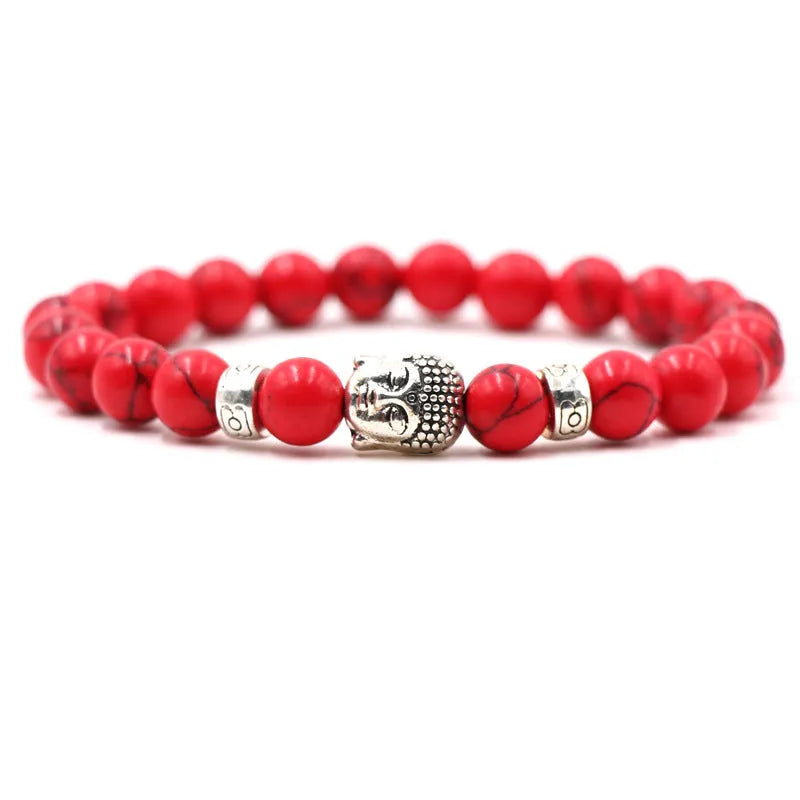 Tigereye stone Buddha head stretch bracelet with 8mm beads on a wrist.
