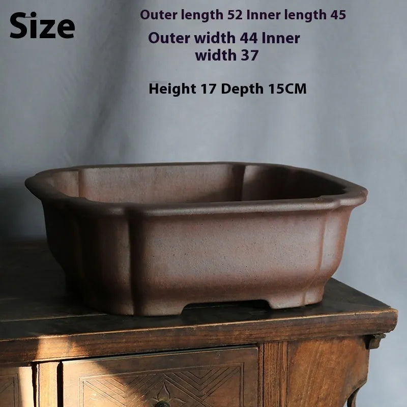 Purple sand rectangular bonsai flower pot with modern simple design on wooden surface