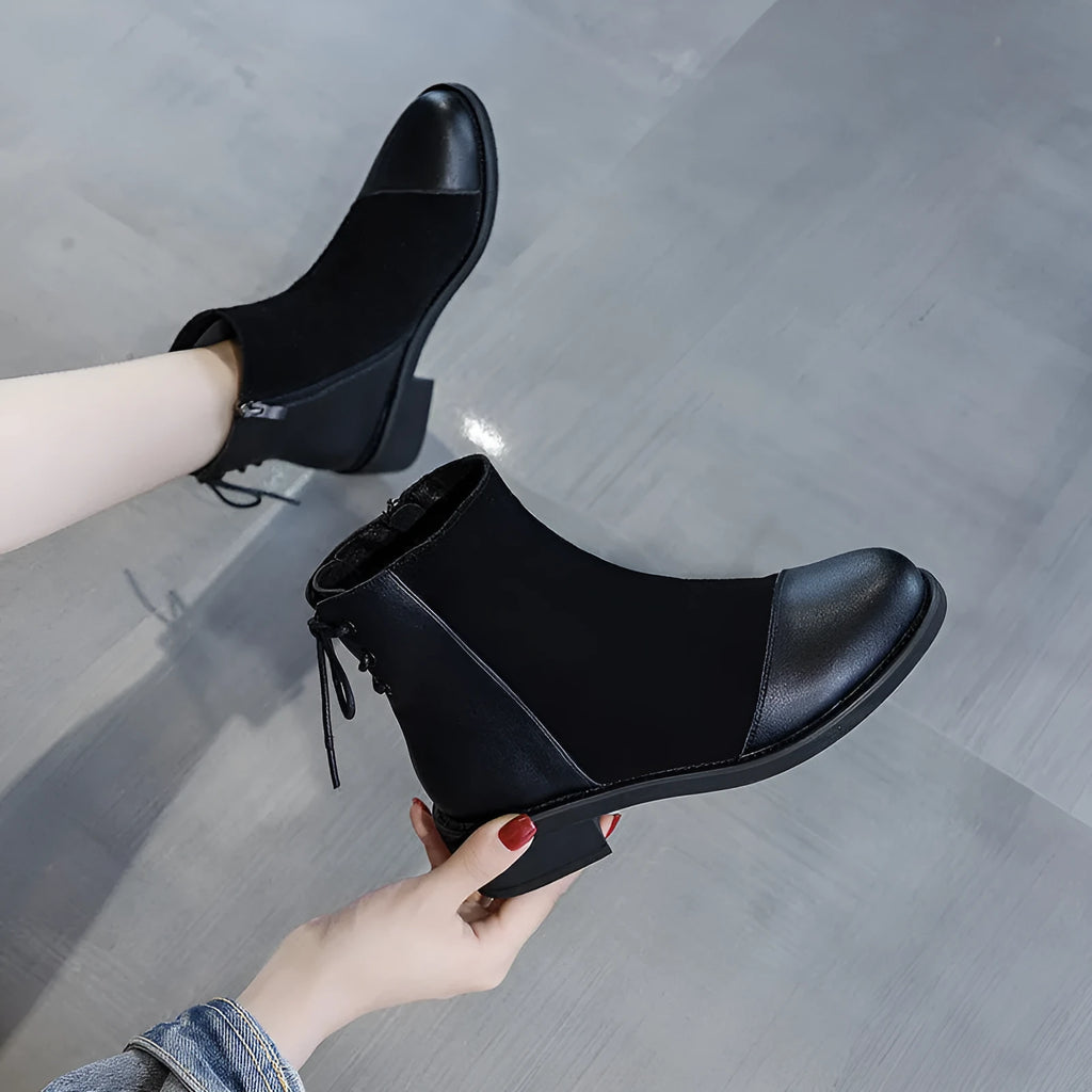 Women's black knee-high Martin boots with side zip and bow detail