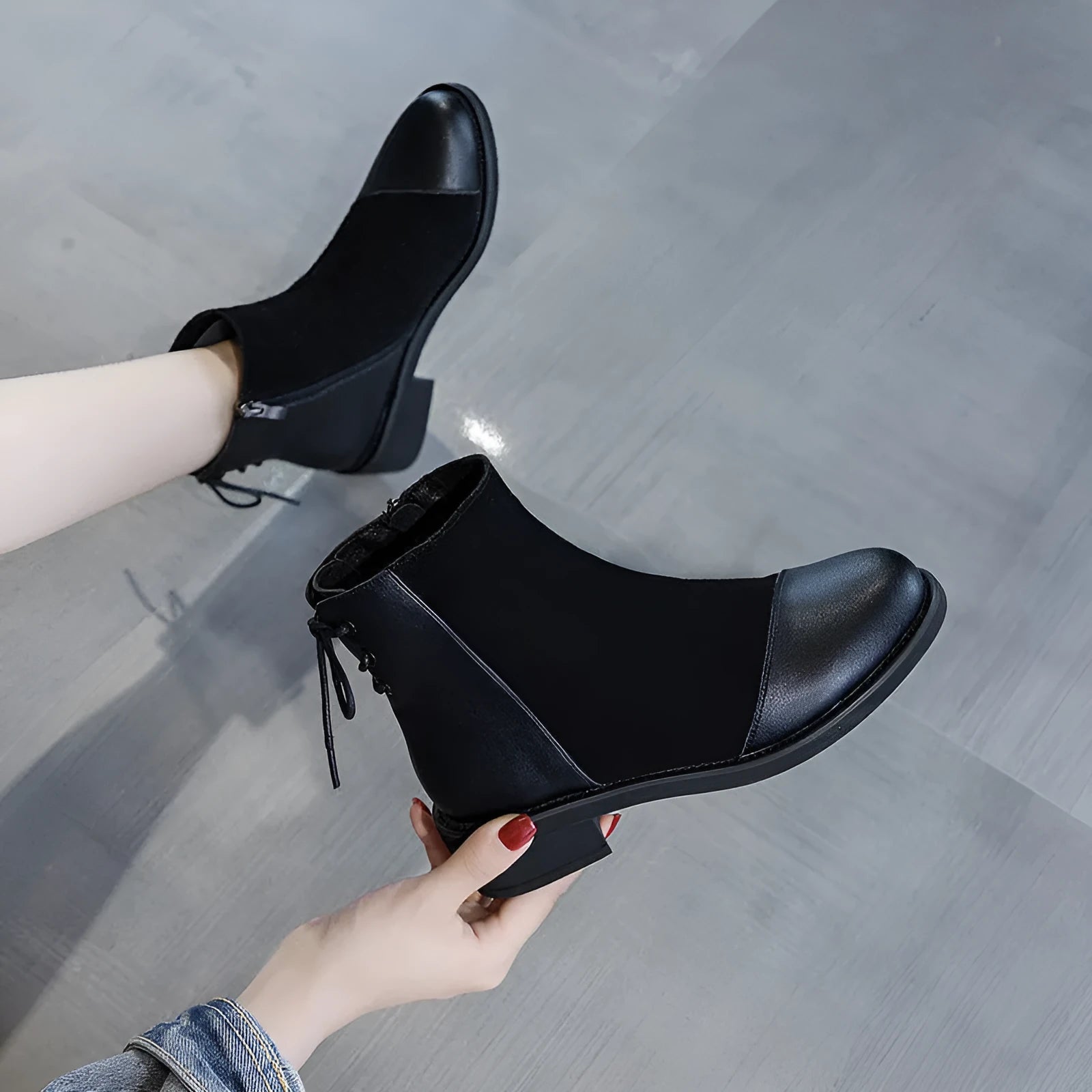 Women's black knee-high Martin boots with side zip and bow detail
