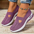 Elderly woman's black mesh T-strap shoe with soft PVC sole and round toe