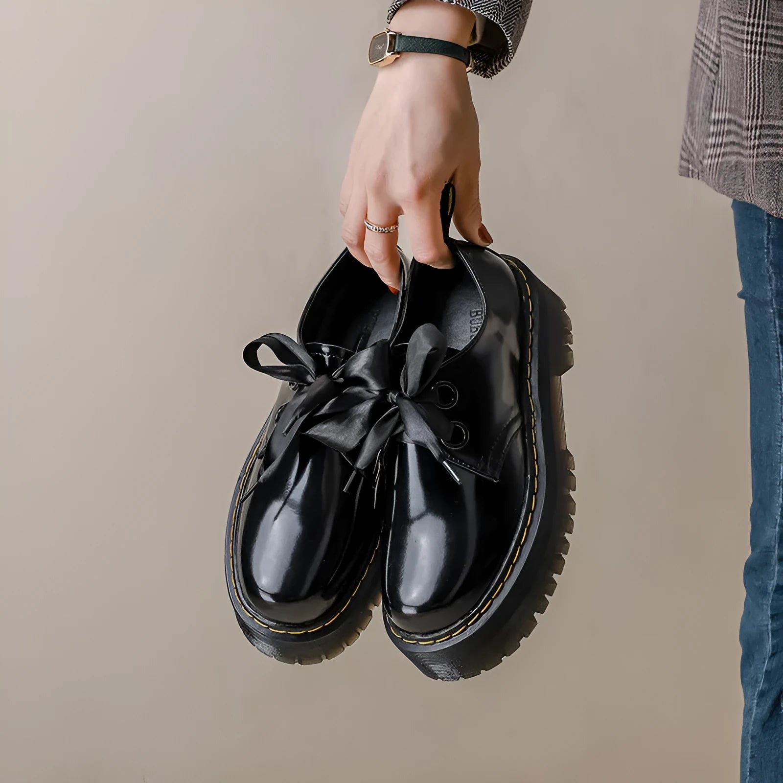 Women's thick soled leather shoes with ribbon and cross strap details in white or black