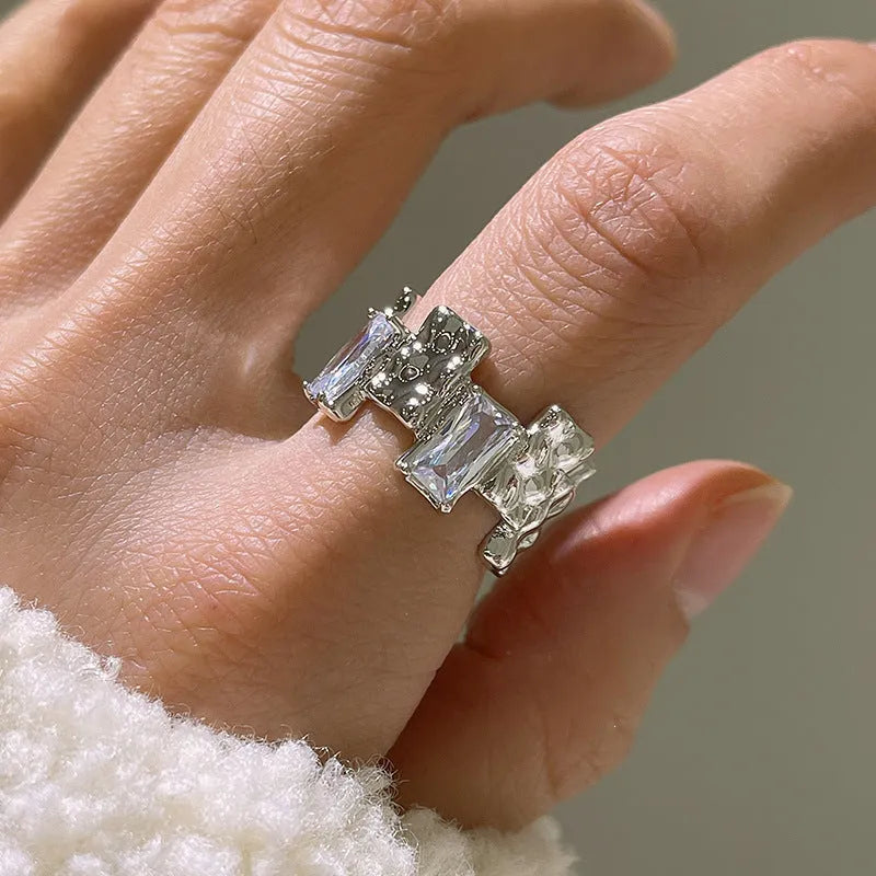 Silver geometric cross ring with open zircon gemstone design and three-dimensional decoration