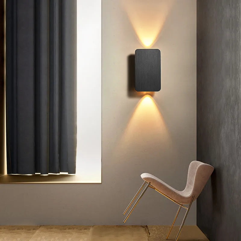 Minimalist Nordic style LED wall lamp in black finish mounted on wall showing adjustable light feature
