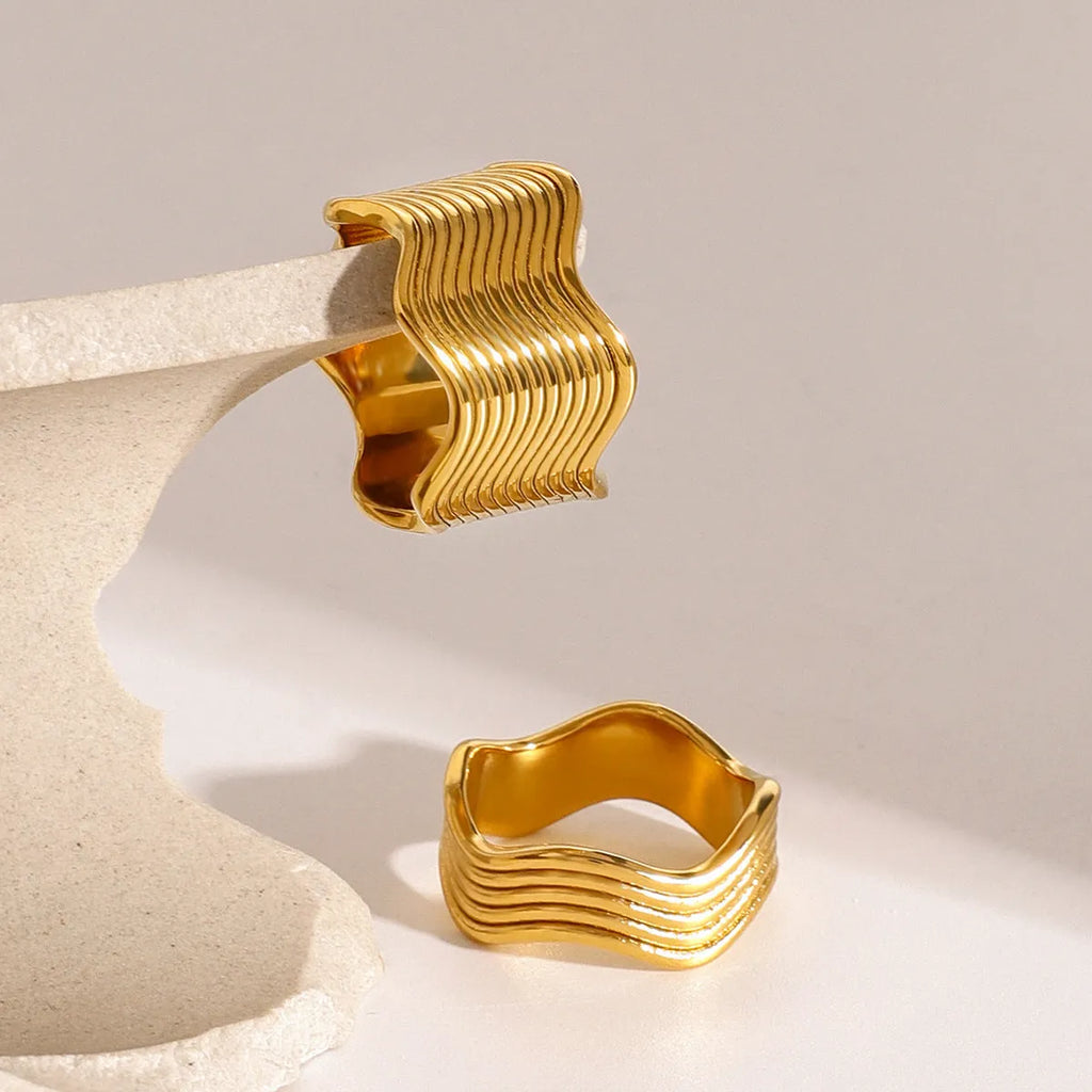 Stainless steel wide band ring with geometric wave pattern design