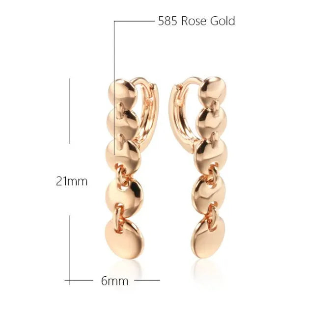 Gold coloured woven copper circle drop earrings with retro design