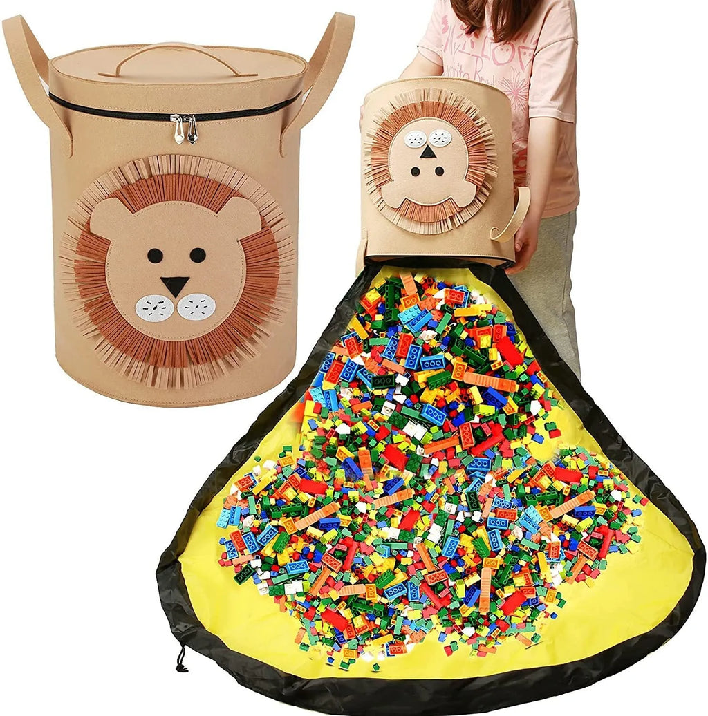 Green cube-shaped felt storage bag with pull rope lying flat as a play mat.