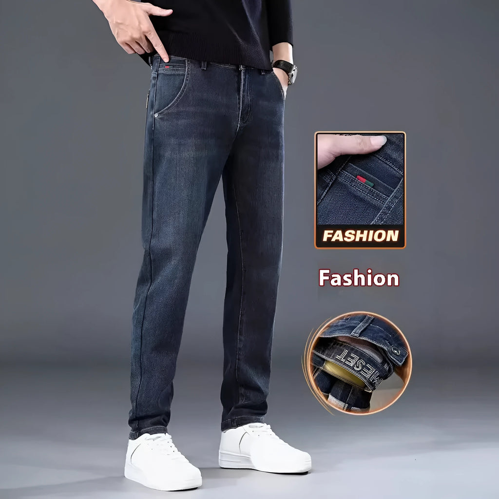 Blue grey slim straight casual trousers with a mid-waist and elastic comfort on a neutral background.
