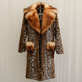 Women's long artificial fur jacket in leopard print with regular sleeves.