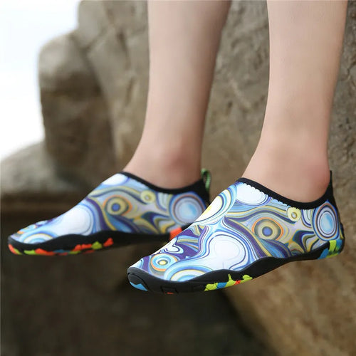 Beach wading shoes with stretch Lycra uppers and EVA midsoles in blue, black, pink, purple, and camouflage colours