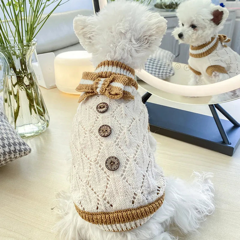 Bowknot hollow knit dog sweater in coffee white on a small dog, lattice pattern shown