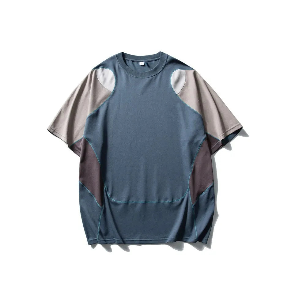 Men's loose fit blue patchwork sports T-shirt with raglan short sleeves on a hanger.